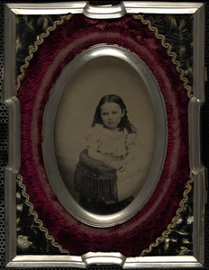 Portrait of child in tassel chair