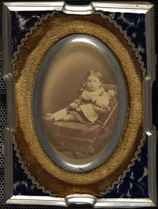 Portrait of child with doll