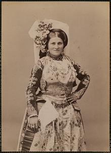 Studio portrait of woman in traditional Greek dress