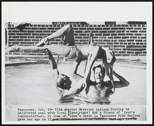 Film starlet Beverley Aadland frolics in California pool with Errol Flynn(right) and a friend of Flynn's (unidentified). At time of Flynn's death in Vancouver Miss Aadland gave her age as 17 but later revealed in Seattle that she is 22.