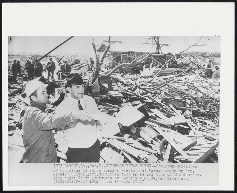 Governor Views Ruins--Gov. John McKeithen of Louisiana is shown tornado wreckage at Larose today by Rep. Richard Guidry, left. McKeithen took an aerial tour of the destruction dealt South Louisiana by Hurricane Hilda.