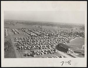 A City on Wheels. More than 1,400 trailers housing over 3,500 persons have assembled at the municipal tourist park here to await the opening of their annual convention from February 8 to the 15th. This view of the camp shows part of the huge gathering of homes on wheels, while lower right is Payne Park, where the Boston Red Sox train each spring.