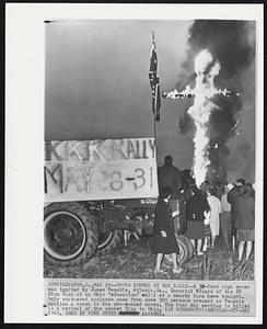 Cross Burned at KKK Rally--A 30-foot high cross was ignited by James Venable, Atlante, Ga., Imperial Wizard of the Ku Klux Klan at an Ohio ‘education’ rally at a nearby farm here tonight. Only scattered applause came from some 300 person present as Venable applied a torch to the pre-soaked cross. The four day meeting is billed as a revival of the secret Klan in Ohio.