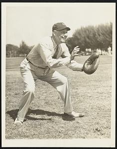 Catching For His Yanks George Ruppert, brother of the late colonel Jacob Ruppert, and now president of the New York Yankees, is shown as he donned a cap and glove to catch a few balls at the Yankee spring training camp, St. Petersburg, Fla., March 10.