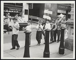 “We Protest” – Roxbury youngsters picket City Hall protesting police ruling they can’t use vacant city land for carnival to raise funds for baseball uniforms. Told Mayor Hynes wasn’t in, the boys said they would be back today. Left to right, Dick Mooradian, Forest St.; Fran Ward, Alpine St.; Larry Foley, Regent St.; Paul Hayes, Akron St.; Dick Brienze, Alpine St.; bill Whiteman, St. James St., and Bill Kirchturn, Dabney Place.