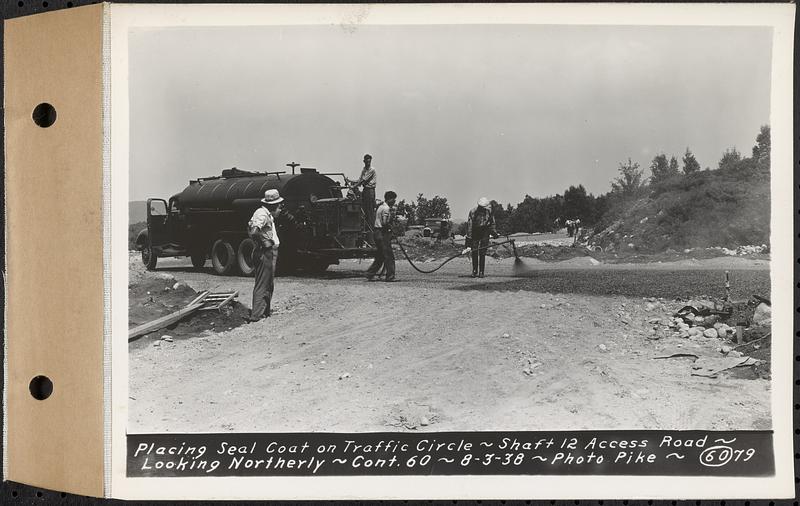 Contract No. 60, Access Roads to Shaft 12, Quabbin Aqueduct, Hardwick and Greenwich, placing seal coat on traffic circle, Greenwich and Hardwick, Mass., Aug. 3, 1938