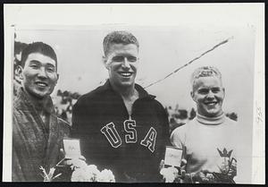 Winners in the Swim at the Olympics were Clark Scholes (center) the 100 meters free style gold medal winner for the United States, Hiroshu Suzuki of Japan (left), who took second place, and Goran Larrson of Sweden, who finished third.