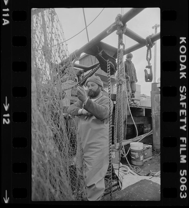 Fisherman fixing a net