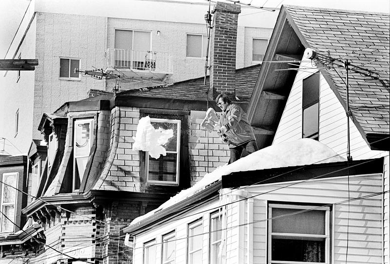 Shoveling snow off the roof