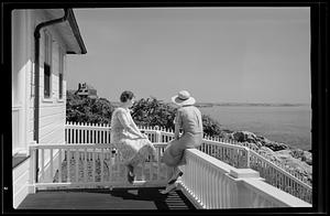 Two women looking out over beach scene