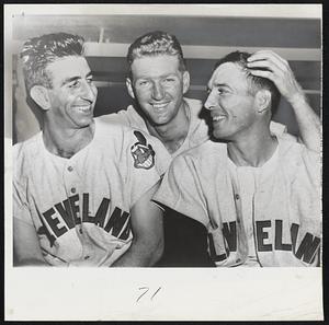 First Score for Score--Cleveland pitcher Herb Score (center), who couldn't beat the Yankees in four tries last year, celebrates his victory over New York, 6-5, yesterday. But he has to express his gratitude to his helpmates, pitcher Don Mossi (left) and outfielder Jim Busby. Mossi was the ninth inning fireman. Busby's weak hit was taken by Yanks hurler Tom Morgan. Morgan's throw hit Busby and bounced out of play, permitting Chicago Carrasquel to score the winning run.