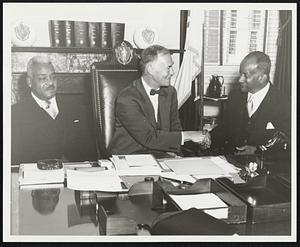 Governor Herter Greets Premier of Barbados: The Honorable G. H. Adams, Premier of Barbados (seated right), is shown above paying a courtesy call upon Governor Herter at the State House in Boston. Seated to the left of the Governor is the Honorable Dr. H.G. Cummins, Deputy Premier and Minister of Social Services.