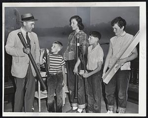 The Experts- Hall Lyman (left), publisher of the Salt Water Sportsman, Inc., awards the prizes to the winners of the Boston Park Department-Boston Traveler fishing Rodeo at Jamaica Pond. The winners, left to right, are William Dennet of South Weymouth, who caught the biggest fish of all; Sandy Cohen, 14, of Dorchester, top girl winner; Bill Connerty. 14, of Jamaica Plain, No. 2 boy, and Theresa Martin, 15, of Jamaica Plain, No. 2 in the girls' competition.