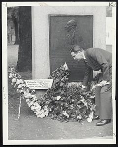 For Lafayette's Memory-Mayor Tobin is shown placing a wreath at the Lafayette tablet on Boston Common today beside a V-shaped wreath placed there earlier by an unknown party. Separate ceremonies were held for the Vichy Government and the Free French.