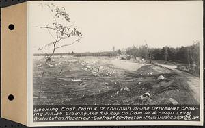 Contract No. 80, High Level Distribution Reservoir, Weston, looking east from center line of Thornton House driveway showing finish grading and riprap on dam 4, high level distribution reservoir, Weston, Mass., Dec. 5, 1939