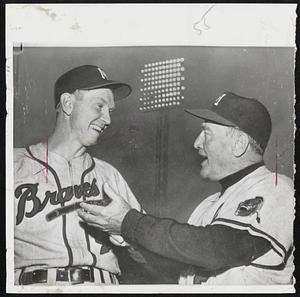 Manager Fred Haney, right, of the pennantbound Braves holds powwow with veteran infielder Red Schoedienst. Red was acquired in midseason from the Giants to add strength at second base. His batting, fielding and spirit have helped lift the Braves.
