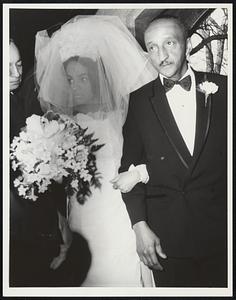 Malvena Pena, of Falmouth arrives at church on the arm of her father, for her wedding to George Scott. Father's name is Manuel Pena.