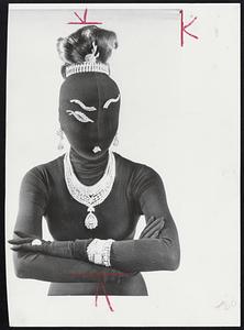 Diamonds valued at $1 million were modeled in Paris by mannequin wearing black leotard and cagoule. Van Cleef and Arpels showed gems as part of exhibition of "surrealist" diamonds.