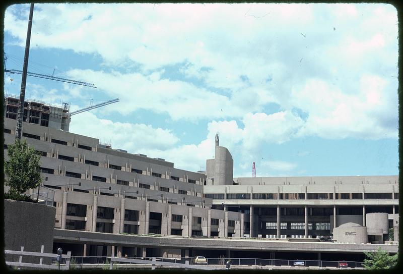 A building with cranes on top