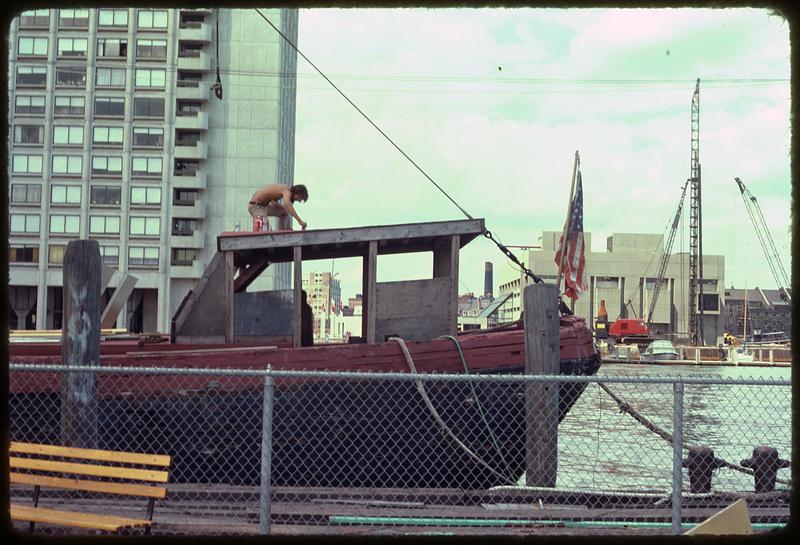 A man on a docked boat