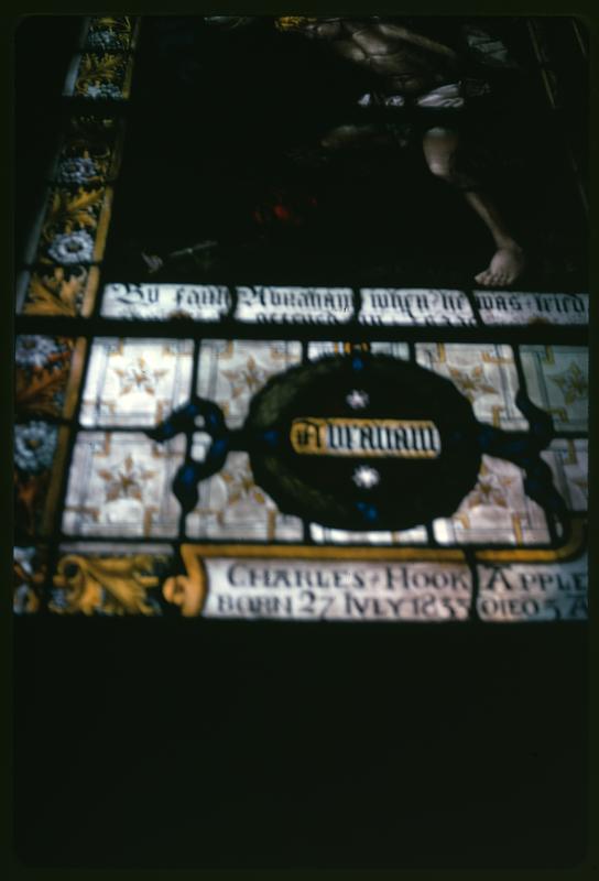 Closeup of a stained glass window dedicated to Charles Hook Appleton