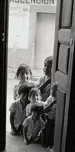 3 children in a doorway, Guatemala