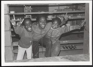 Three friends posing in the clay room