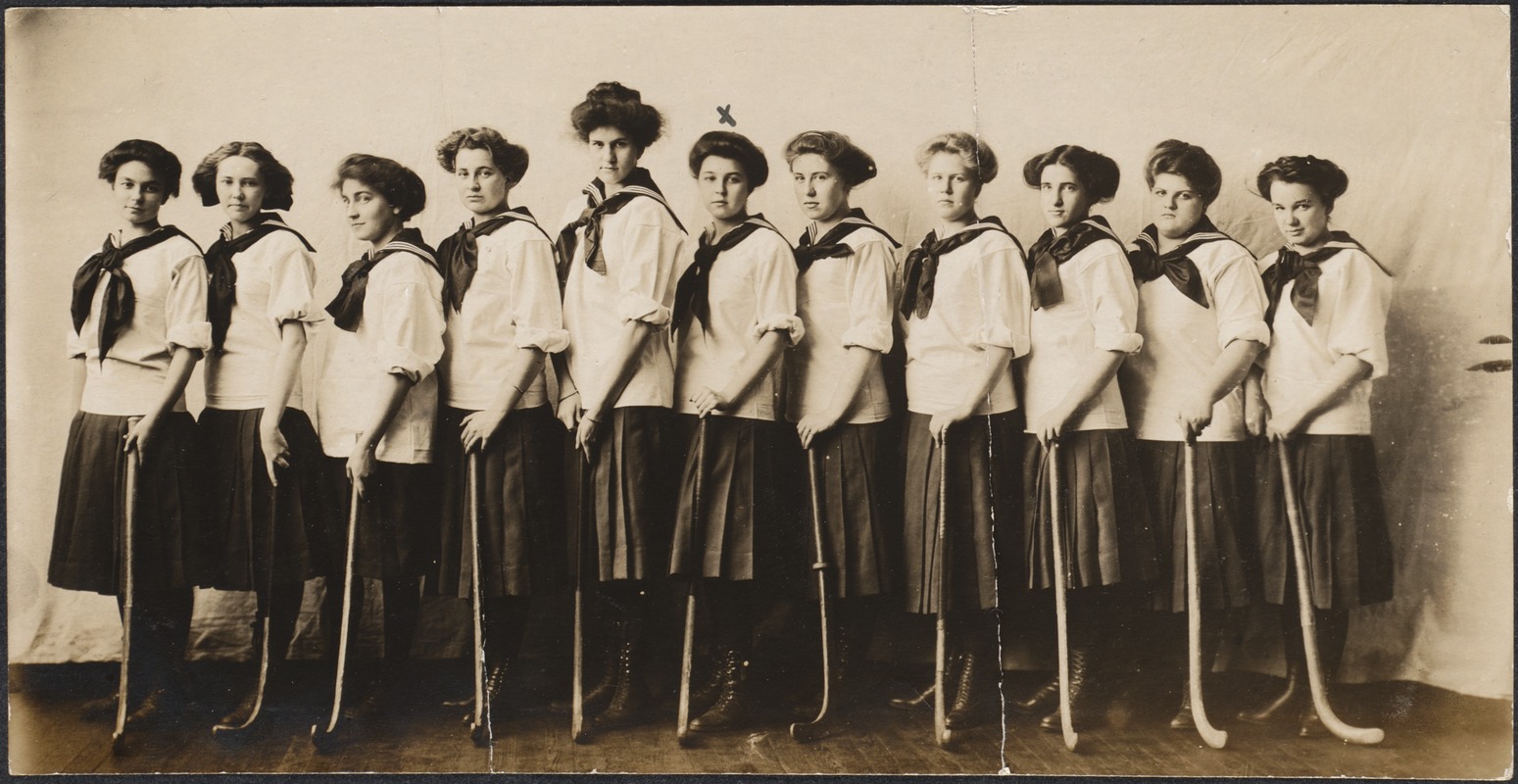 Junior Hockey Team, 1910, standing with hockey sticks