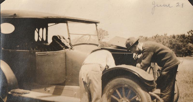 Two men fixing an automobile, West Yarmouth, Mass.