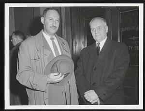 Opposing Lawyers at yesterday's hearing on the milk price fight were Atty. Bernard N. Abrams, left, for the Massachustts Milk Control Commission, and Atty, James C. Gahan, Jr., representing three independent milk dealers fighting price increase.