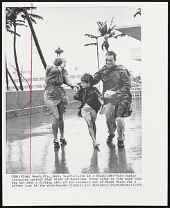 Strolling in a Hurricane--This family struggles against high winds of Hurricane Donna today as they make their way out onto a fishing pier at the southern end of Miami Beach for a better look at the wind-tossed Atlantic.