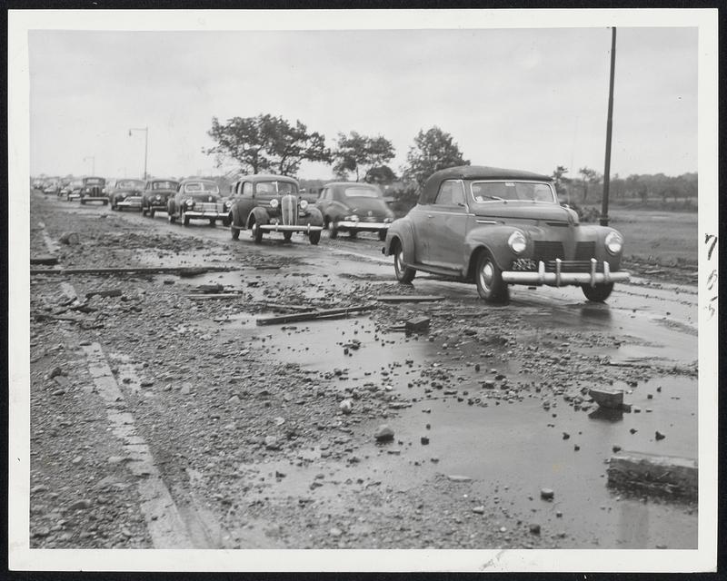 In Wake Of High Tide Planks, stone and gravel litter Quincy Shore