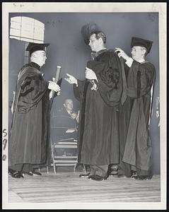 Another Degree for Tobin – Secretary of Labor Tobin receives an honorary doctor of laws degree from the Very Rev. John A. Flynn (left), president of St. John’s University, Brooklyn, N.Y. Assisting Tobin with his hood is the Rev. Cyril F. Meyer, dean of St. John’s College.
