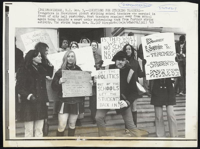 Questions for Striking Teachers--Youngsters in Providence picket striking school teachers who marched in front of city hall yesterday. Most teachers remained away from school again today despite a court order restraining them from further strike activity. The strike began Nov. 24.