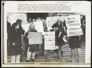 Questions for Striking Teachers--Youngsters in Providence picket striking school teachers who marched in front of city hall yesterday. Most teachers remained away from school again today despite a court order restraining them from further strike activity. The strike began Nov. 24.