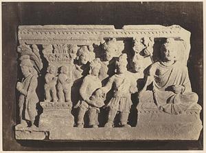 Carving of Buddha with disciples