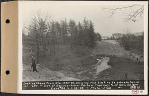 Contract No. 44, Extension of Belchertown-Pelham Highway, New Salem, Orange, looking ahead from Sta. 1040+00, showing mat blasting to subresistance on left, New Salem, Mass., Jan. 19, 1934