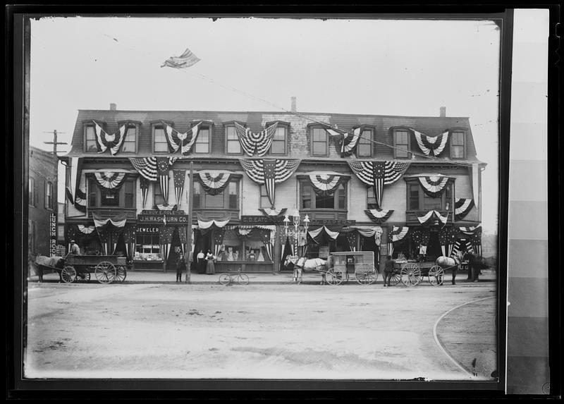 Ahern’s block in red, white & blue bunting, corner Middlesex Ave and Main St.