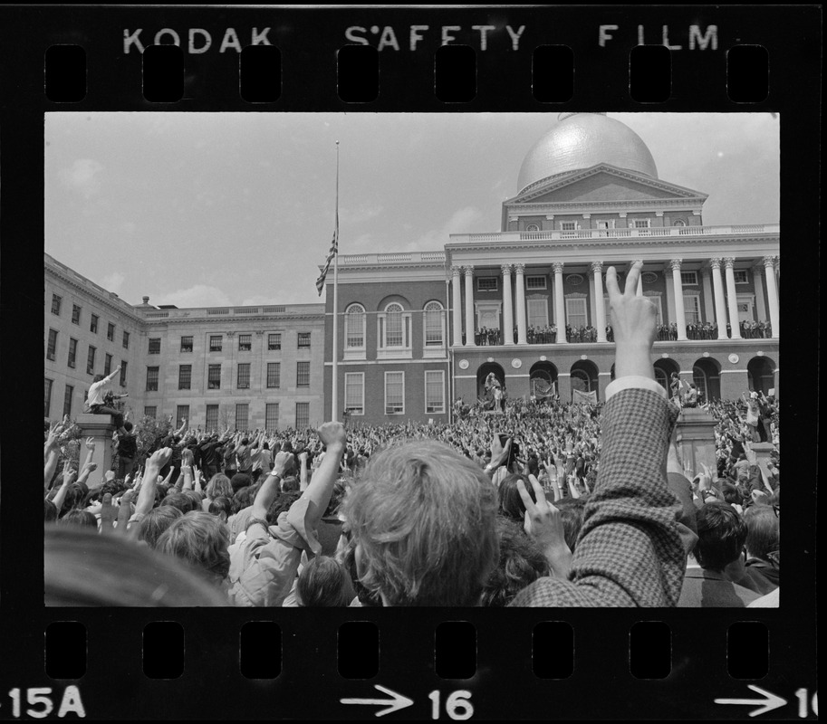 Student protesters at State House salute flag at half-mast during protest of US march into Cambodia and the killing of four Ohio students at Kent State