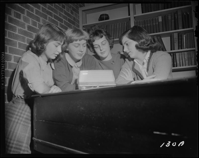 Four women listening to radio