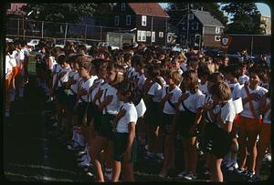 Track team with hands over hearts, Somerville