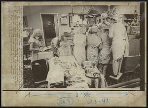 Heart Transplant Team at Work -- The heart team at St. Luke's episcopal Hospital at Houston headed by Dr. Denton Cooley, center under lamps facing camera, shown during the tenth heart transplant operation performed Monday. The recipient was Carl V. Bates, 50-year0old shoe store owner of Amarillo, Texas. He received the heart of a Houston housewife.