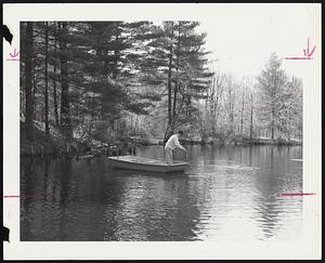 Darrold Hickman of North Attleboro releases a trout at Norfolk Fly-Fishing Club.