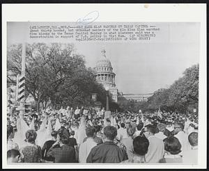 Klu Klux Klan Marches on Texas Capitol -- About thirty hooded, but unmasked members of the Klu Klux Klan marched five blocks to the Texas Capitol Sunday in what klansmen said was a demonstration in support of U.S. policy in Vietnam.