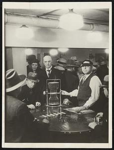 Reno Mayor Views Chuck-A-Luck. Mayor E.E. Roberts, of Reno, Nev., standing directly behind the chuck-a-luck machine, was an interested spectator as Nevada celebrated return to wide-open legalized gambling. The mayor, a pioneer of the days of the old west, seems to know what it is all about.