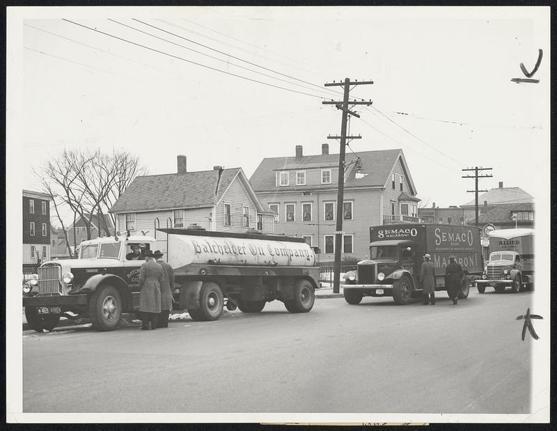 Trucks Halted as Big Strike Starts. Rhode Island became a test ground march 20 for a three-state truck drivers deadlock, with pickets getting an early morning start to halt movement of trucks through the state. This was a scene at dawn at Pawtucket, showing pickets stopping an assortment of vehicles. Strike resulted from a wage controversy involving some 1200 owners and 10,000 drivers in Rhode Island, Massachusetts and Connecticut, with the drivers of Rhode Island only walking out.