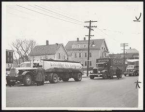 Trucks Halted as Big Strike Starts. Rhode Island became a test ground march 20 for a three-state truck drivers deadlock, with pickets getting an early morning start to halt movement of trucks through the state. This was a scene at dawn at Pawtucket, showing pickets stopping an assortment of vehicles. Strike resulted from a wage controversy involving some 1200 owners and 10,000 drivers in Rhode Island, Massachusetts and Connecticut, with the drivers of Rhode Island only walking out.