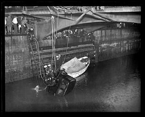 A car getting pulled out of water