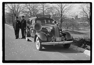 Policemen standing next to Boston Police Safety Education vehicle, Back Bay Fens