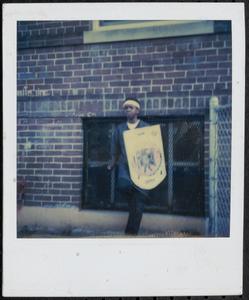 Boy posing with a shield